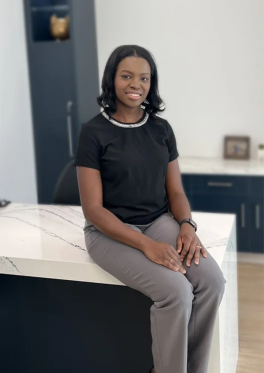 Female staff member smiling indoors